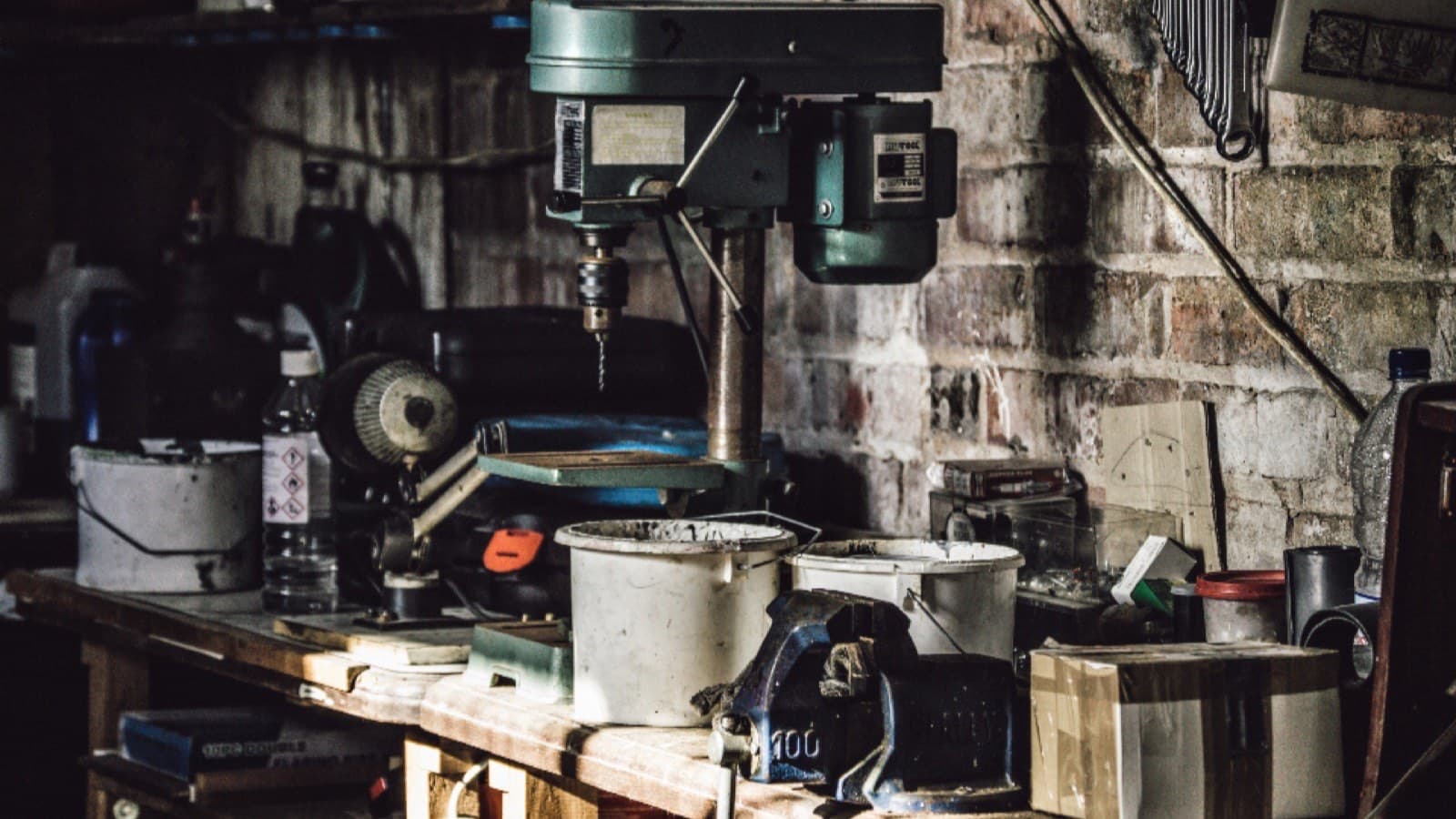 A workshop bench with tools laid out across it