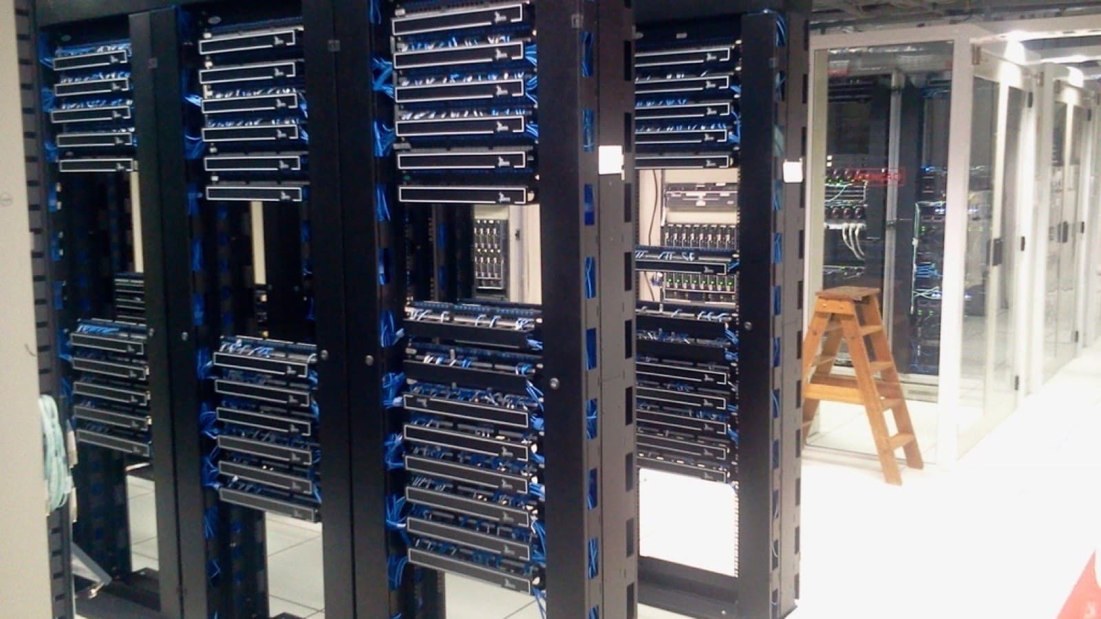 Rows of server racks in a data center