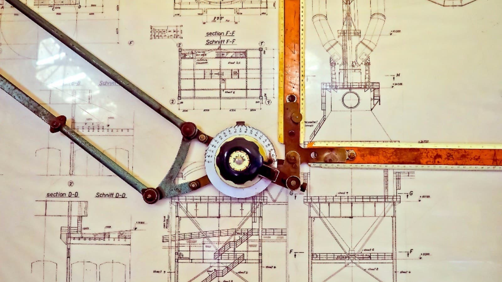 A technical blueprint drawing spread out on a surface