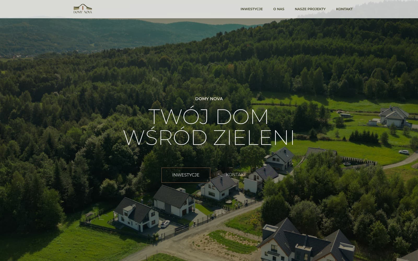 Domy Nova's homepage, showing an aerial photograph of a housing development among forested hills